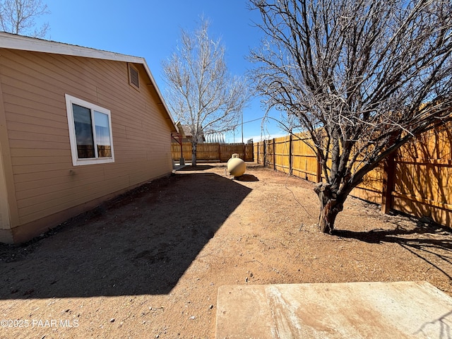 view of yard with a fenced backyard