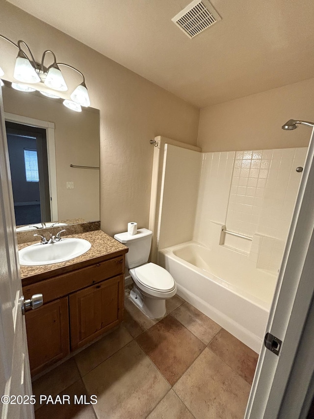 bathroom with visible vents, toilet, vanity, tile patterned flooring, and shower / bathtub combination