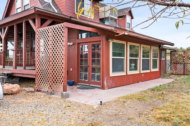 view of side of property with french doors