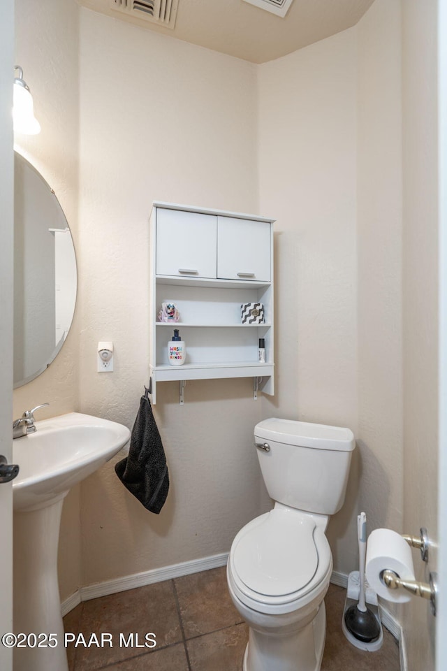 248 Lakewood Cv, Prescott, AZ 86301 - bathroom with toilet, baseboards, and tile patterned flooring