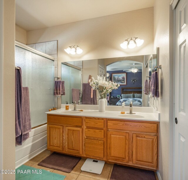 248 Lakewood Cv, Prescott, AZ 86301 - ensuite bathroom with double vanity, tile patterned flooring, shower / bath combination with glass door, and a ceiling fan