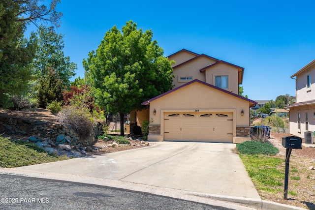 248 Lakewood Cv, Prescott, AZ 86301 - view of front of home with stone siding, a garage, and stucco siding
