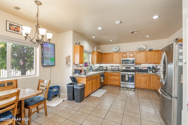248 Lakewood Cv, Prescott, AZ 86301 - kitchen with stainless steel appliances, a chandelier, light tile patterned floors, a sink, and recessed lighting