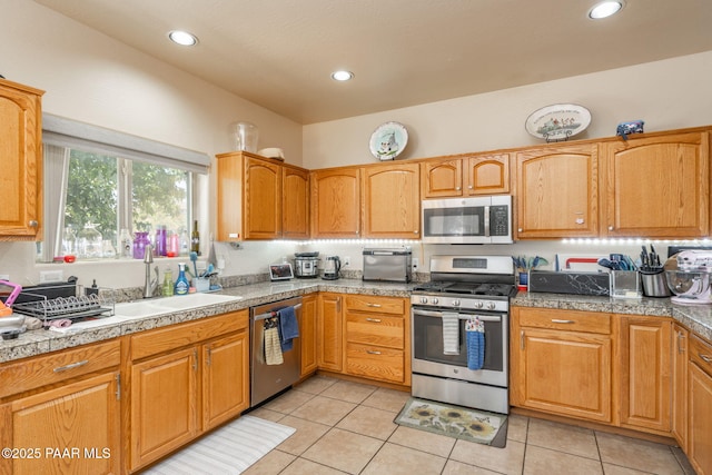 248 Lakewood Cv, Prescott, AZ 86301 - kitchen with appliances with stainless steel finishes, a sink, light tile patterned floors, recessed lighting, and tile counters