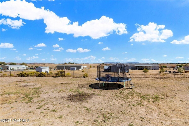 view of yard with a trampoline