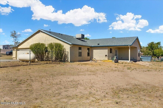 back of property featuring cooling unit