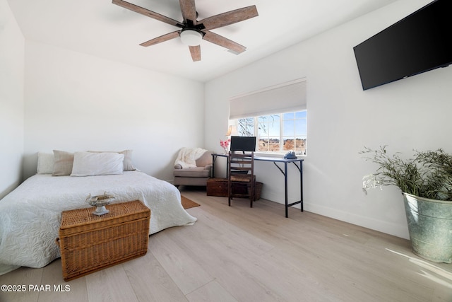 bedroom with ceiling fan and light hardwood / wood-style floors