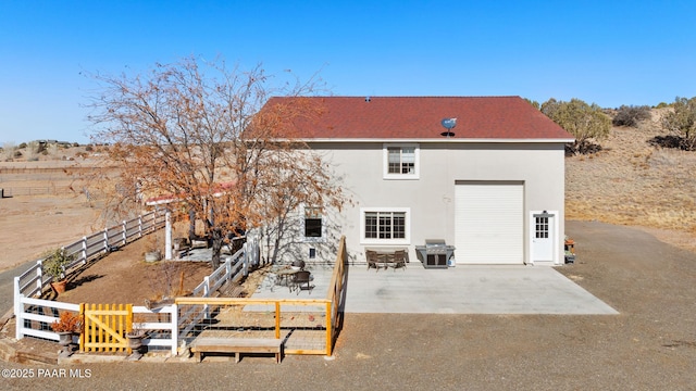 back of house featuring a patio area