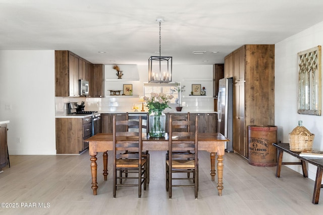 dining space featuring light hardwood / wood-style floors