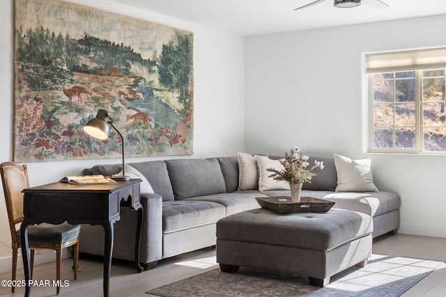 living room with hardwood / wood-style flooring and ceiling fan