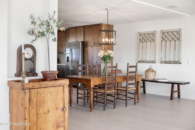 dining area featuring a chandelier