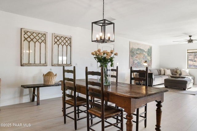 dining area featuring ceiling fan and light hardwood / wood-style flooring