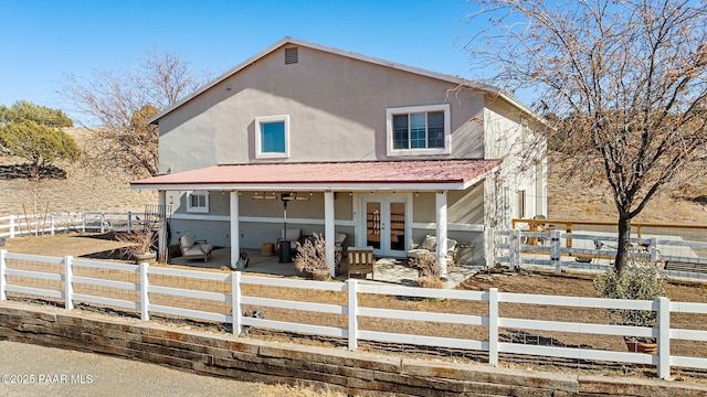 back of property with french doors