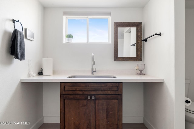 bathroom with vanity and toilet