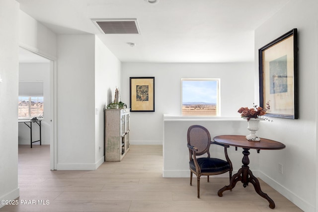 sitting room featuring light hardwood / wood-style flooring