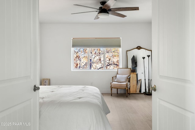 bedroom with ceiling fan and light wood-type flooring