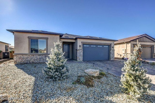 prairie-style house featuring a garage