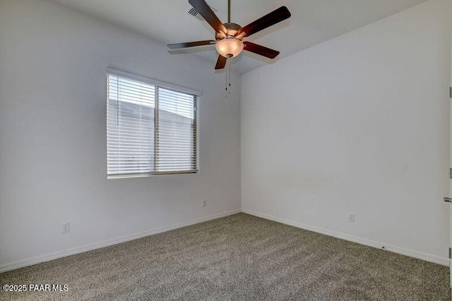 unfurnished room with ceiling fan and carpet floors