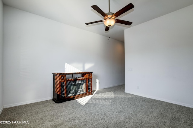 unfurnished living room with carpet and ceiling fan