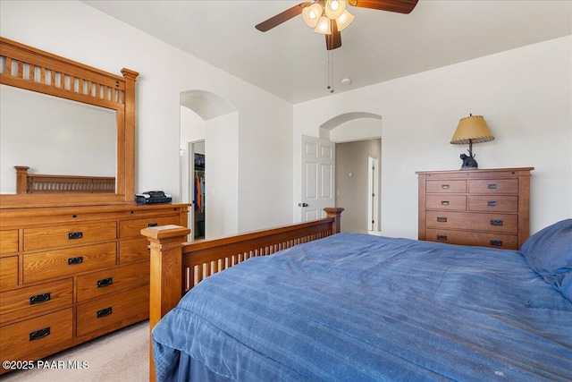 12912 E Santiago St, Dewey-Humboldt, AZ 86327 - bedroom featuring arched walkways, light carpet, and ceiling fan