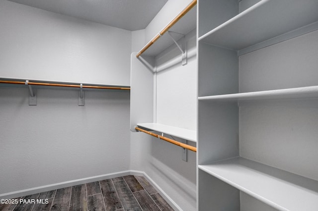7506 E Roaring Canyon Rd, Prescott Valley, AZ 86315 - walk in closet featuring dark wood finished floors