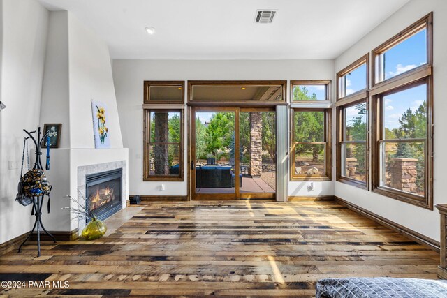 unfurnished living room featuring hardwood / wood-style flooring