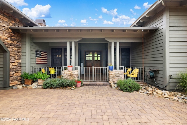 entrance to property with a porch