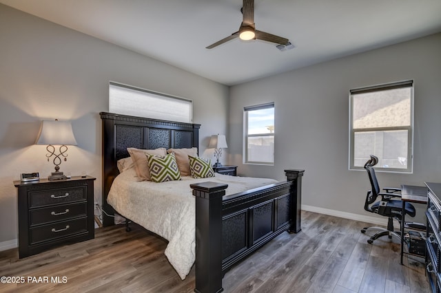 bedroom featuring hardwood / wood-style flooring and ceiling fan