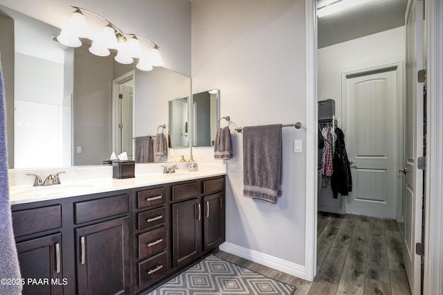 bathroom with vanity and hardwood / wood-style floors