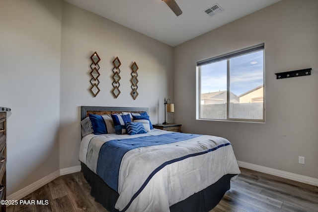 bedroom with hardwood / wood-style floors and ceiling fan