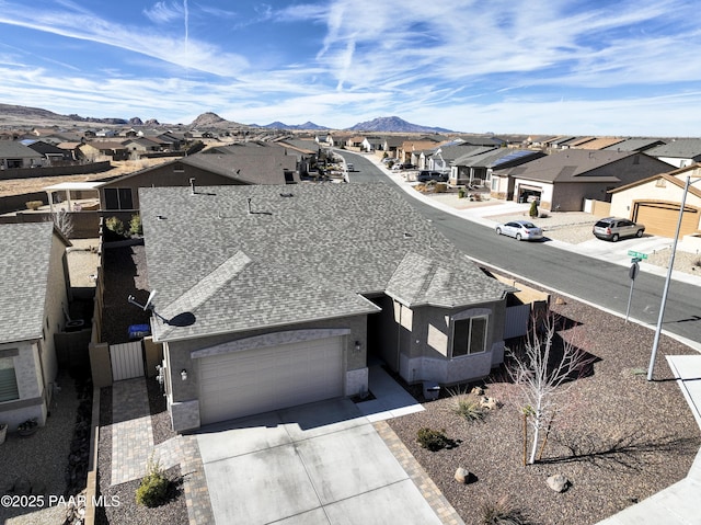 drone / aerial view featuring a mountain view