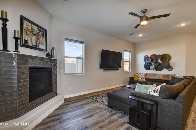 living room with hardwood / wood-style flooring and ceiling fan