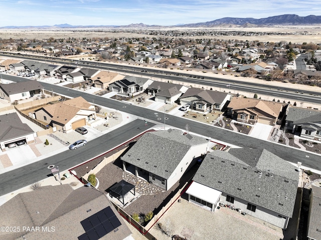 birds eye view of property featuring a mountain view