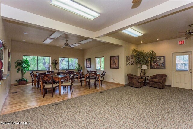 dining area with plenty of natural light, ceiling fan, and wood finished floors
