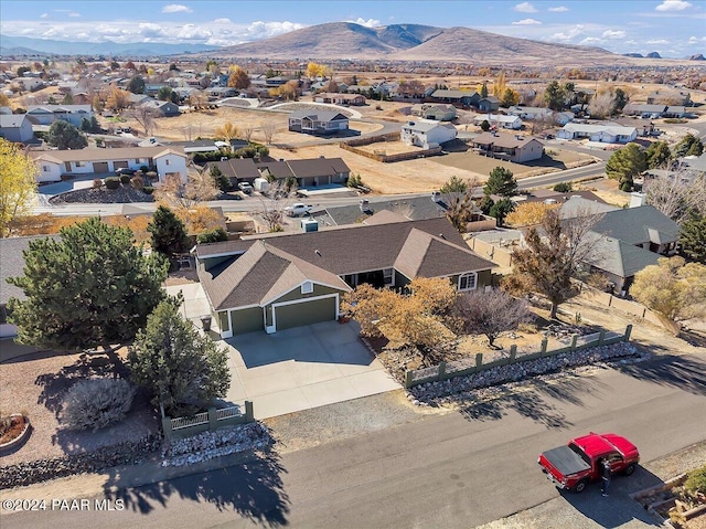 birds eye view of property featuring a mountain view