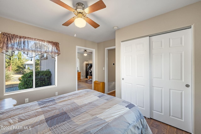 bedroom with hardwood / wood-style flooring, ceiling fan, and a closet