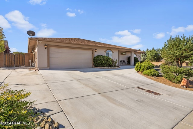 mediterranean / spanish house featuring a garage