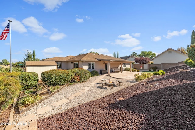 rear view of house with a patio