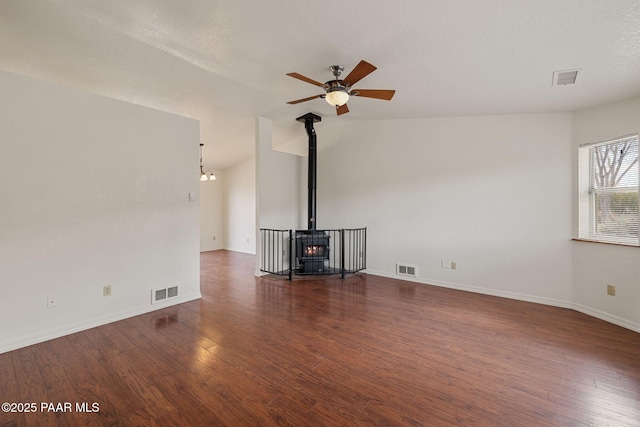 unfurnished living room with visible vents, wood finished floors, and ceiling fan