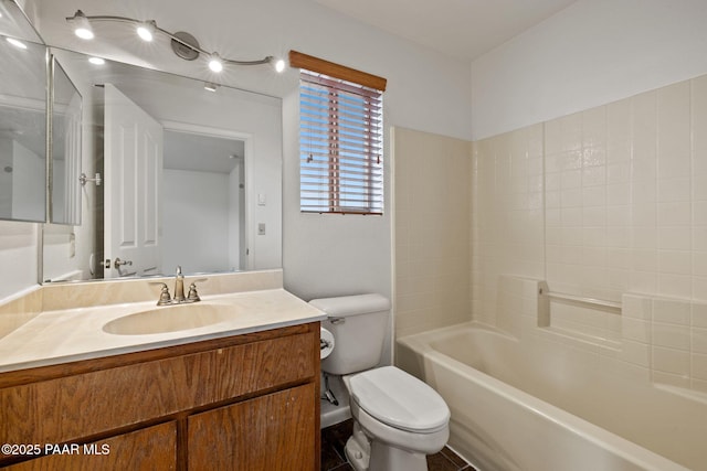 bathroom featuring toilet and vanity