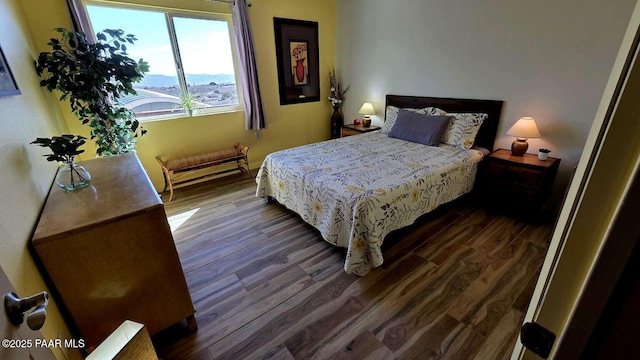 bedroom with ceiling fan and wood finished floors