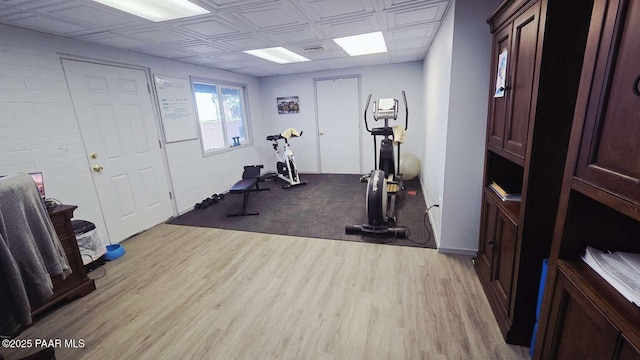 office area with baseboards and wood finished floors
