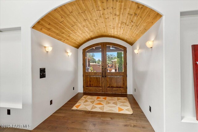 15345 N Badlands Cir, Prescott, AZ 86305 - foyer entrance featuring wood finished floors, vaulted ceiling, arched walkways, wood ceiling, and french doors