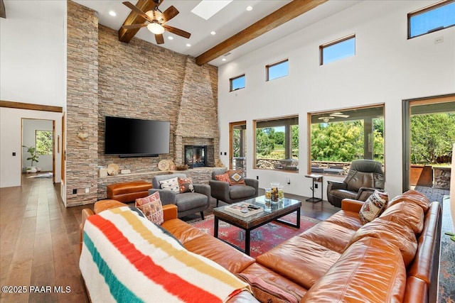 15345 N Badlands Cir, Prescott, AZ 86305 - living room with beam ceiling, a high ceiling, a ceiling fan, wood-type flooring, and healthy amount of natural light
