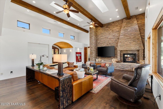 15345 N Badlands Cir, Prescott, AZ 86305 - living room with a ceiling fan, beam ceiling, a towering ceiling, a skylight, and dark wood-style floors