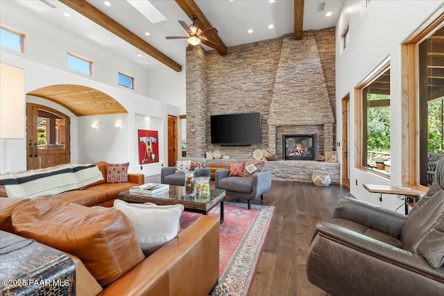15345 N Badlands Cir, Prescott, AZ 86305 - living room featuring wood-type flooring, a high ceiling, beamed ceiling, a ceiling fan, and arched walkways