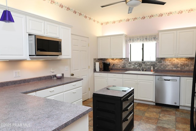 1980 S Koch Ranch Rd, Cornville, AZ 86325 - kitchen with a sink, decorative backsplash, appliances with stainless steel finishes, and a ceiling fan