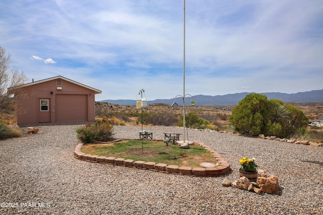 1980 S Koch Ranch Rd, Cornville, AZ 86325 - view of yard with an outbuilding, a mountain view, and a garage