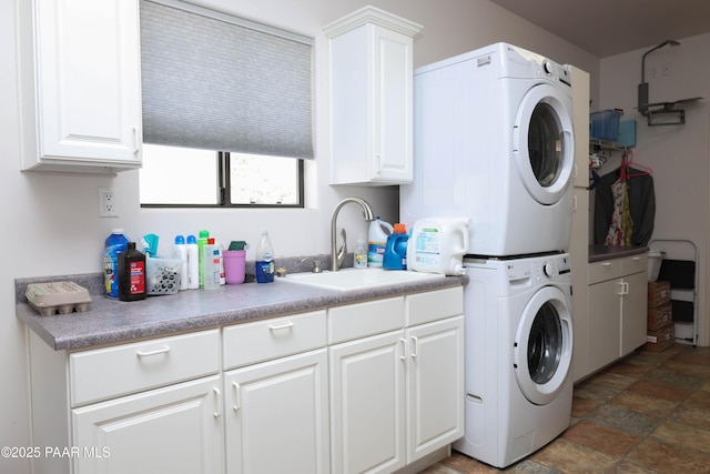 1980 S Koch Ranch Rd, Cornville, AZ 86325 - clothes washing area with stone finish flooring, a sink, cabinet space, and stacked washer / drying machine