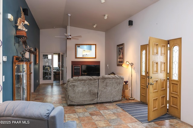 1980 S Koch Ranch Rd, Cornville, AZ 86325 - living room featuring high vaulted ceiling, a glass covered fireplace, stone finish floor, and ceiling fan
